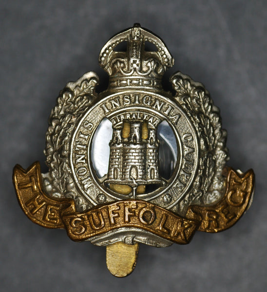 Suffolk Regiment cap badge.